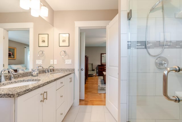 2 Neptune Rd, Old Orchard Beach, ME 04064 - full bathroom with ensuite bath, a stall shower, double vanity, and tile patterned flooring
