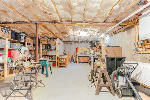2 Neptune Rd, Old Orchard Beach, ME 04064 - unfinished basement featuring water heater and a workshop area