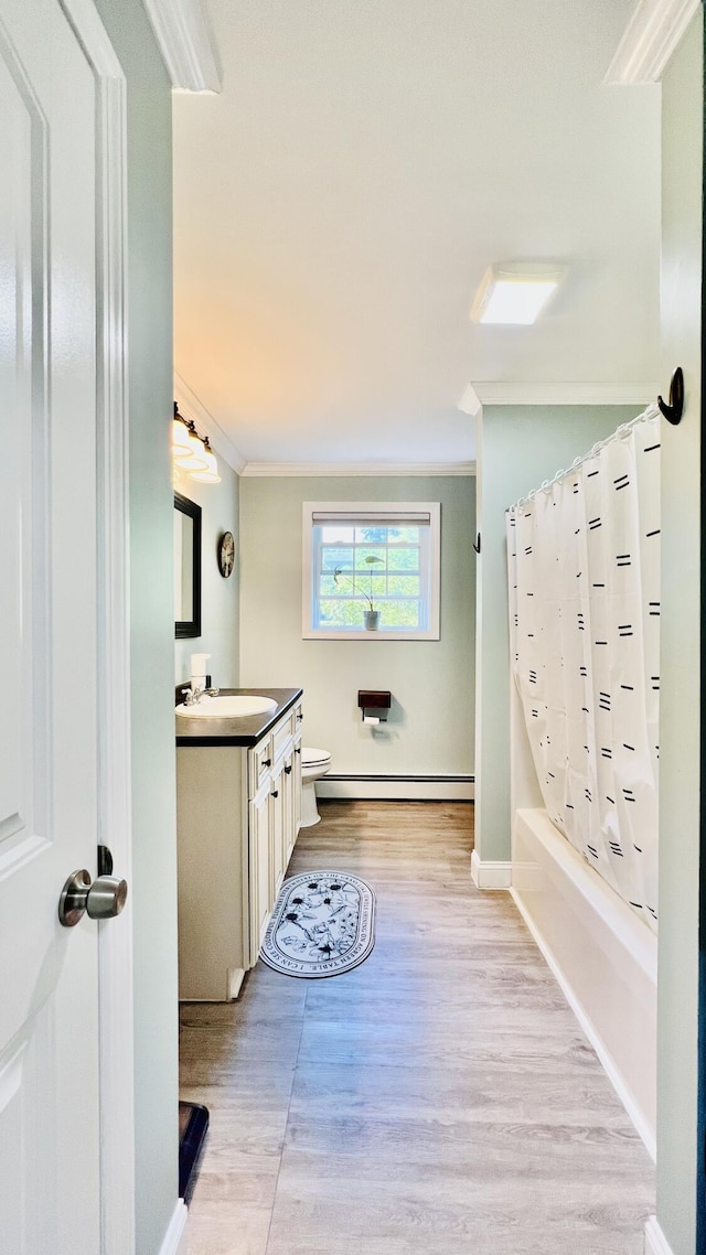 40 Ellis Ct, Bangor, ME 04401 - full bath with ornamental molding, baseboard heating, toilet, vanity, and wood finished floors