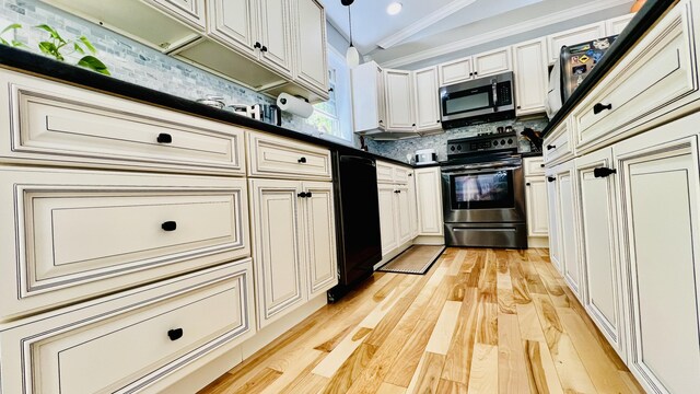 40 Ellis Ct, Bangor, ME 04401 - kitchen with stainless steel appliances, dark countertops, decorative backsplash, light wood-style flooring, and ornamental molding