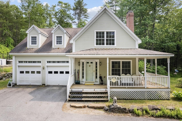 30 Oliver Woods Rd, Nobleboro, ME 04555 - view of front facade featuring driveway, covered porch, an attached garage, and a shingled roof