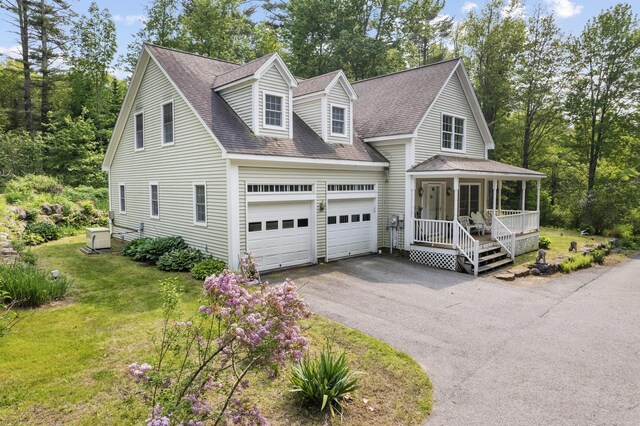 30 Oliver Woods Rd, Nobleboro, ME 04555 - view of front of home featuring covered porch, driveway, a garage, and a shingled roof