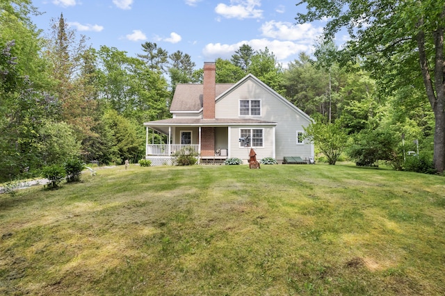30 Oliver Woods Rd, Nobleboro, ME 04555 - view of front of home featuring a front yard, a chimney, and covered porch