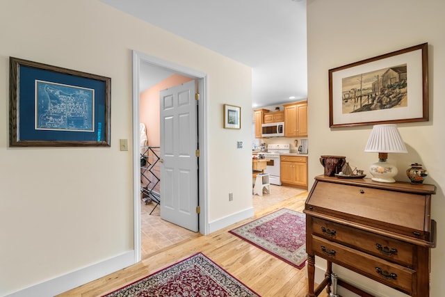30 Oliver Woods Rd, Nobleboro, ME 04555 - corridor featuring light wood-style flooring and baseboards