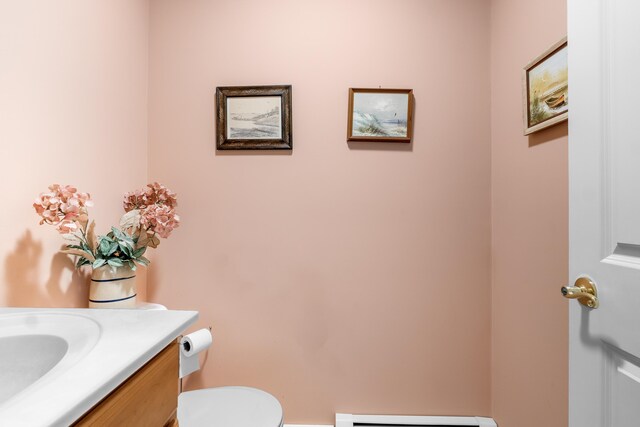 30 Oliver Woods Rd, Nobleboro, ME 04555 - half bath featuring vanity, toilet, and baseboard heating