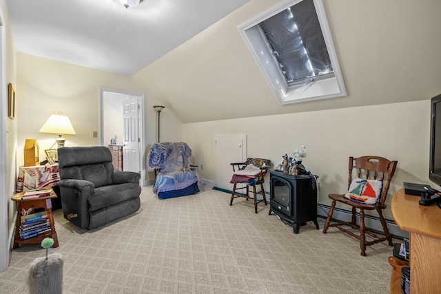 30 Oliver Woods Rd, Nobleboro, ME 04555 - sitting room with vaulted ceiling, a wood stove, light colored carpet, and a baseboard heating unit