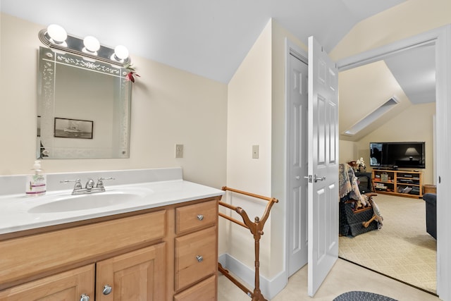 30 Oliver Woods Rd, Nobleboro, ME 04555 - bathroom with lofted ceiling, vanity, and baseboards