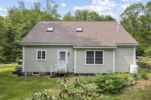 30 Oliver Woods Rd, Nobleboro, ME 04555 - rear view of house with entry steps, a shingled roof, and a lawn