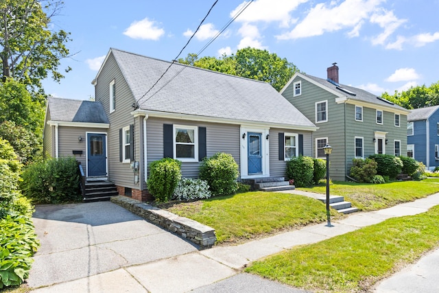 194 Margaret St, South Portland, ME 04106 - view of front of house with a front yard, entry steps, and roof with shingles