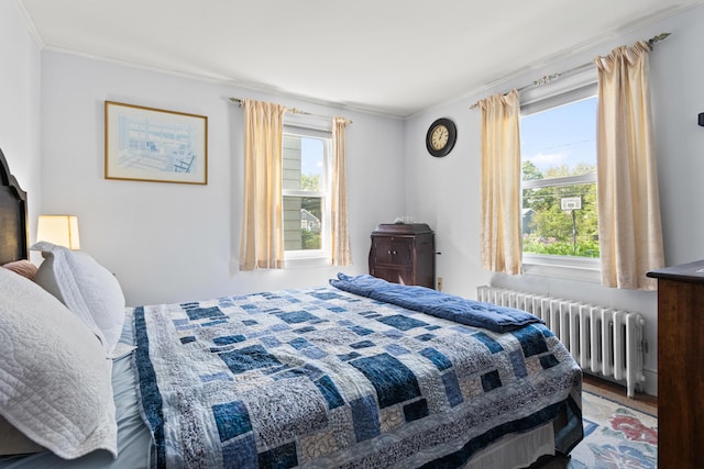 194 Margaret St, South Portland, ME 04106 - bedroom with radiator heating unit, multiple windows, crown molding, and wood finished floors