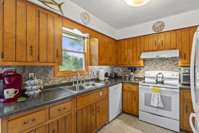 2 Laase Ave, Lewiston, ME 04240 - kitchen featuring white appliances, under cabinet range hood, brown cabinets, backsplash, and a textured ceiling