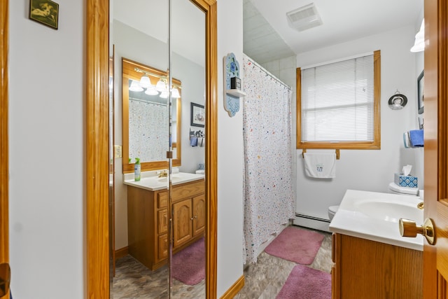 2 Laase Ave, Lewiston, ME 04240 - bathroom featuring a baseboard heating unit, vanity, and curtained shower