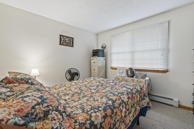 2 Laase Ave, Lewiston, ME 04240 - carpeted bedroom featuring a baseboard heating unit and baseboards