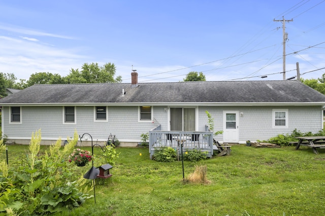 2 Laase Ave, Lewiston, ME 04240 - back of house featuring a chimney, a lawn, a wooden deck, and roof with shingles