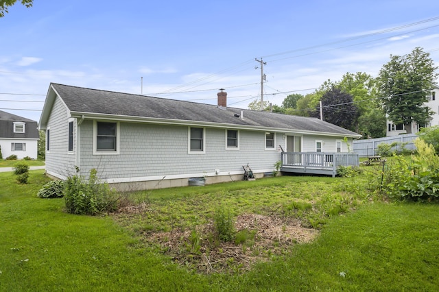 2 Laase Ave, Lewiston, ME 04240 - rear view of house with a wooden deck, a lawn, a chimney, and roof with shingles
