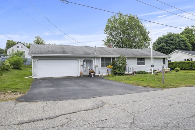 2 Laase Ave, Lewiston, ME 04240 - view of front of house with a garage, a front lawn, driveway, and a chimney