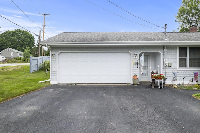 2 Laase Ave, Lewiston, ME 04240 - garage featuring driveway