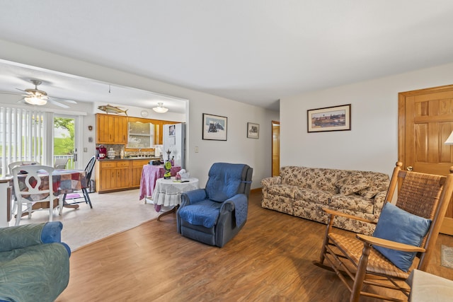 2 Laase Ave, Lewiston, ME 04240 - living area with light wood-style floors and a ceiling fan
