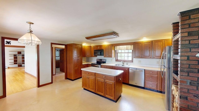124 Swan Rd, Hermon, ME 04401 - kitchen with stainless steel appliances, a sink, light countertops, and brown cabinetry