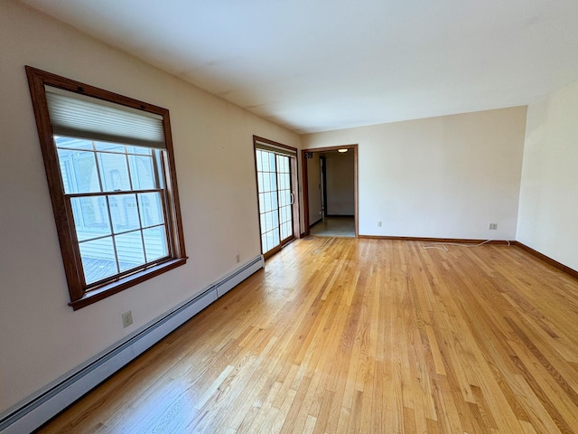 124 Swan Rd, Hermon, ME 04401 - unfurnished room with a baseboard heating unit, light wood finished floors, and baseboards