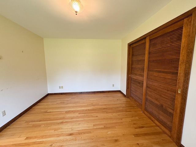 124 Swan Rd, Hermon, ME 04401 - unfurnished bedroom with light wood-type flooring, a closet, and baseboards