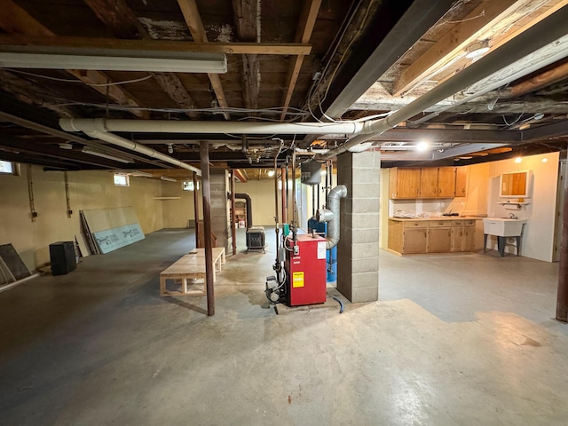 124 Swan Rd, Hermon, ME 04401 - unfinished basement featuring a heating unit and a sink