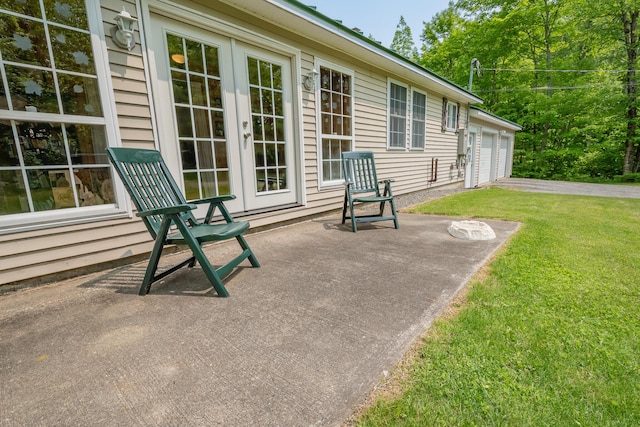 52A Judkins Rd, Harmony, ME 04942 - view of patio / terrace featuring a garage and french doors
