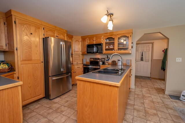 52A Judkins Rd, Harmony, ME 04942 - kitchen featuring freestanding refrigerator, black microwave, stone finish floors, and electric range oven