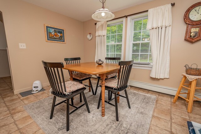52A Judkins Rd, Harmony, ME 04942 - dining area with plenty of natural light, baseboards, and light stone finish floors