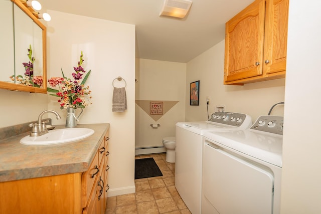 52A Judkins Rd, Harmony, ME 04942 - laundry area featuring a baseboard radiator, washing machine and dryer, baseboards, and stone finish flooring