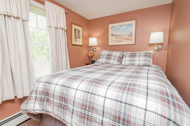 52A Judkins Rd, Harmony, ME 04942 - carpeted bedroom with a baseboard radiator