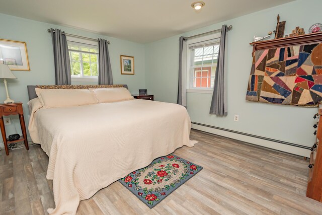 52A Judkins Rd, Harmony, ME 04942 - bedroom with baseboard heating and wood finished floors