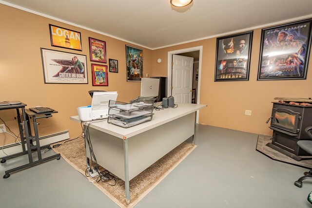 52A Judkins Rd, Harmony, ME 04942 - office with a wood stove, finished concrete floors, a baseboard heating unit, and ornamental molding
