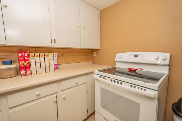52A Judkins Rd, Harmony, ME 04942 - kitchen with white range with electric stovetop and light countertops