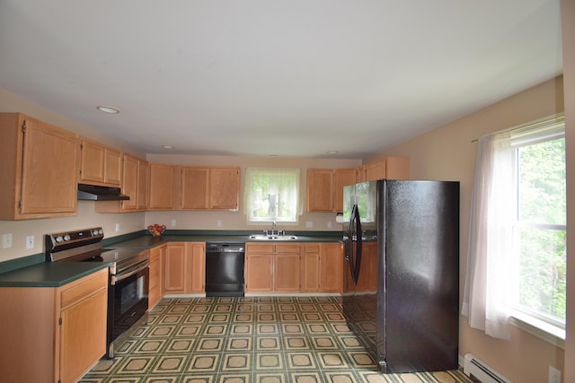 31 Curtis St, South Portland, ME 04106 - kitchen featuring black appliances, a baseboard heating unit, dark countertops, under cabinet range hood, and light flooring