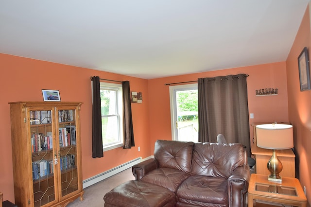 31 Curtis St, South Portland, ME 04106 - living room featuring a baseboard heating unit and carpet