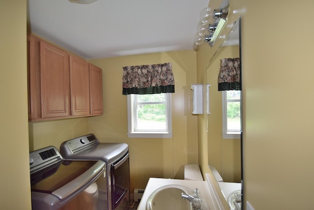 31 Curtis St, South Portland, ME 04106 - washroom featuring washer and clothes dryer, baseboard heating, and cabinet space