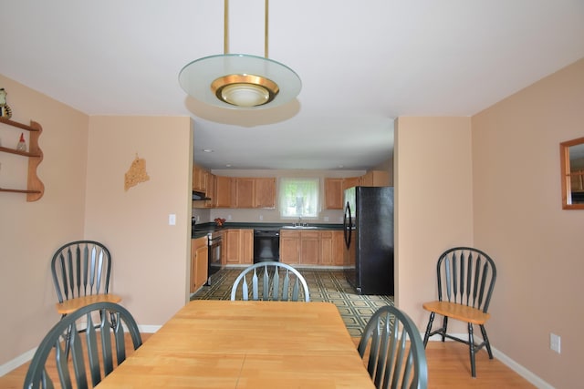 31 Curtis St, South Portland, ME 04106 - dining room with baseboards and light wood-style floors