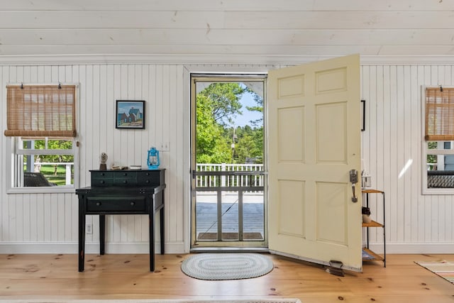 74 Ottawa Ave, Portland, ME 04109 - entryway with hardwood / wood-style floors and wooden walls