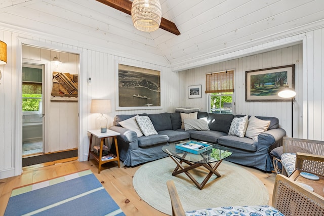 74 Ottawa Ave, Portland, ME 04109 - living room with wood finished floors, lofted ceiling, a ceiling fan, and wood walls