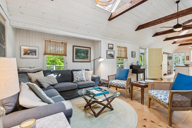 74 Ottawa Ave, Portland, ME 04109 - living area with light wood-style flooring, a skylight, a ceiling fan, and wooden walls