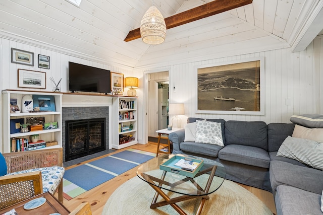 74 Ottawa Ave, Portland, ME 04109 - living room featuring wood finished floors, a fireplace with flush hearth, wooden ceiling, and wood walls
