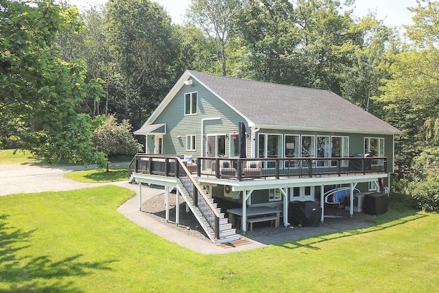 42 Barter Rd, Rockland, ME 04841 - rear view of house with a wooden deck, a lawn, stairs, and a shingled roof