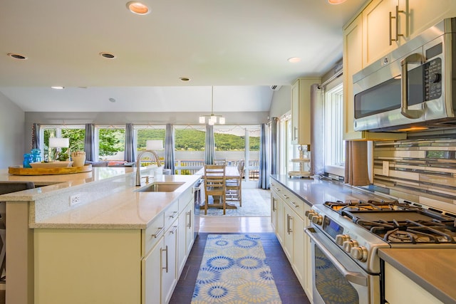 42 Barter Rd, Rockland, ME 04841 - kitchen with stainless steel appliances, a kitchen island with sink, light stone countertops, recessed lighting, and pendant lighting