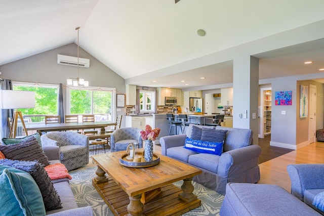 42 Barter Rd, Rockland, ME 04841 - living room featuring a wall unit AC, wood finished floors, high vaulted ceiling, and recessed lighting