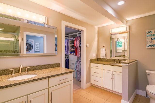 42 Barter Rd, Rockland, ME 04841 - full bath with tile patterned floors, a shower stall, washer / clothes dryer, two vanities, and a spacious closet