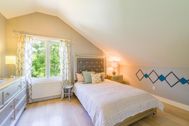 42 Barter Rd, Rockland, ME 04841 - bedroom with radiator heating unit, vaulted ceiling, and light wood-type flooring