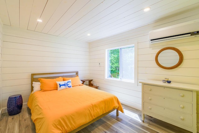 42 Barter Rd, Rockland, ME 04841 - bedroom featuring a wall mounted AC, wooden walls, wood finished floors, and recessed lighting