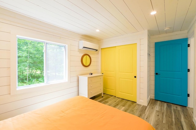 42 Barter Rd, Rockland, ME 04841 - unfurnished bedroom featuring a wall unit AC, wood ceiling, multiple windows, a closet, and light wood-type flooring