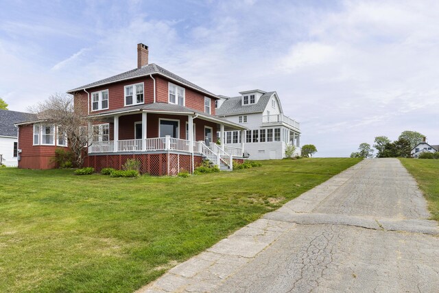 10 S Colony Branch Rd, Harpswell, ME 04079 - view of front of home with a porch, a chimney, and a front yard